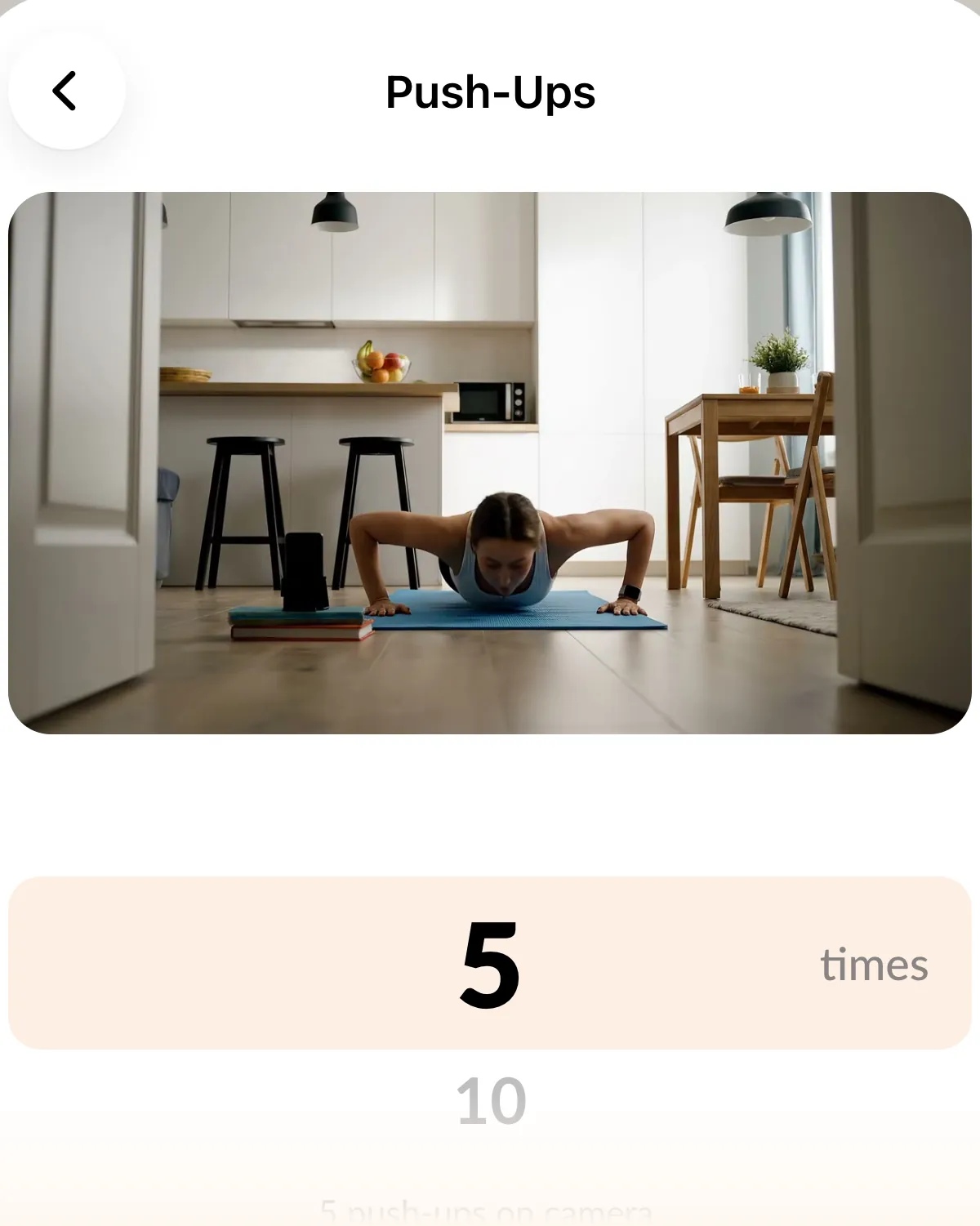 The Push-Ups mission settings: a still from the demo video and a rep wheel set to 5 times.