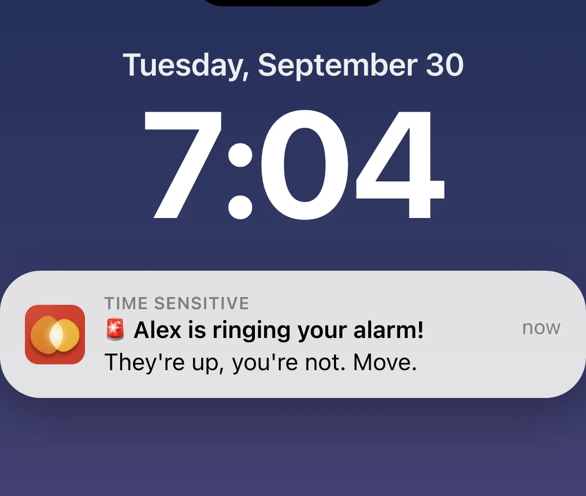 A lock screen with a notification reading Alex is ringing your alarm, They're up, you're not. Move.